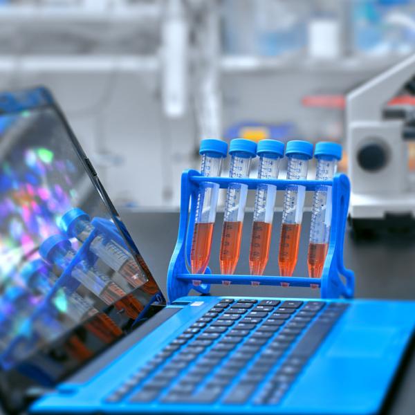 laptop and samples in glass containers